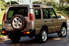 A GOLD LAND ROVER DISCOVERY.