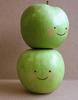 two happy green apples (top)